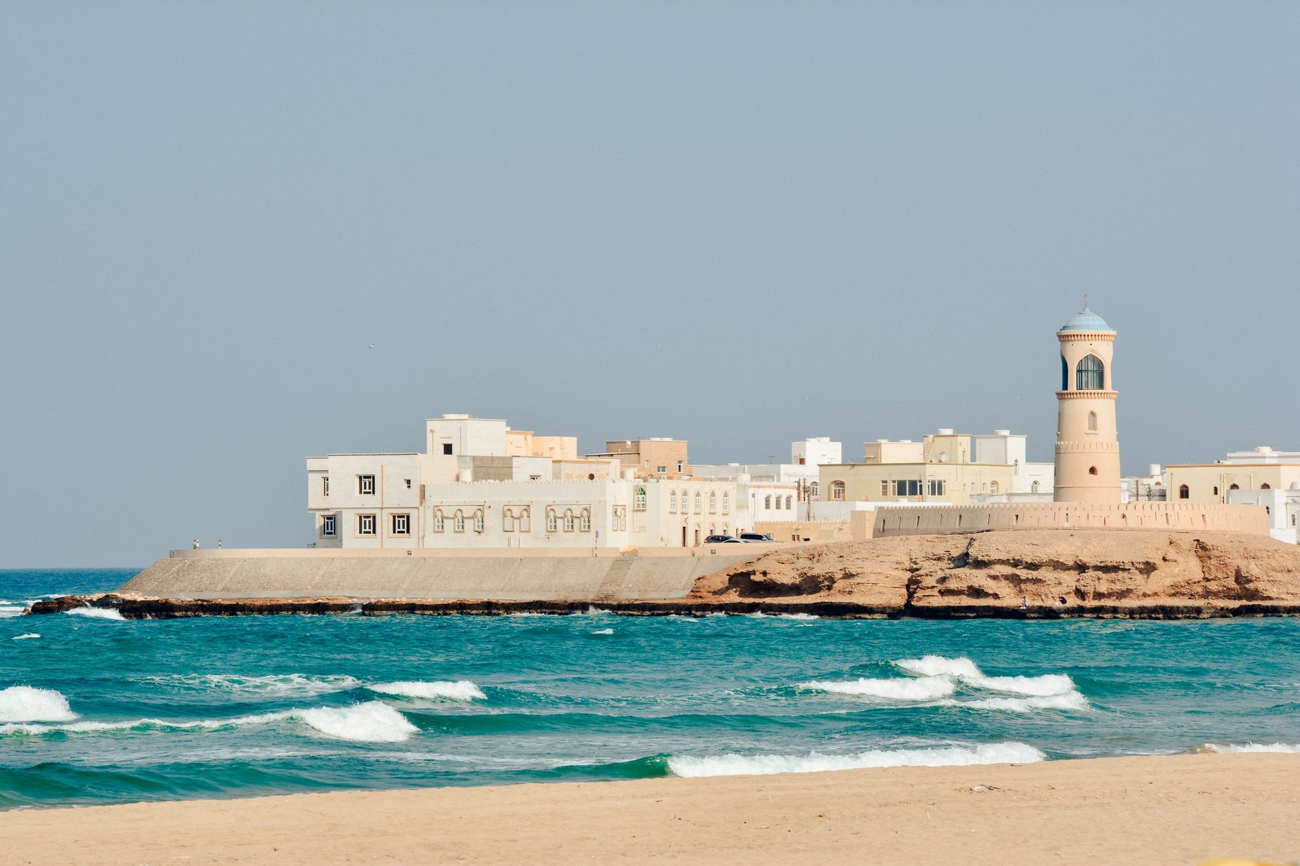 White coastal town and watchtower on the sea