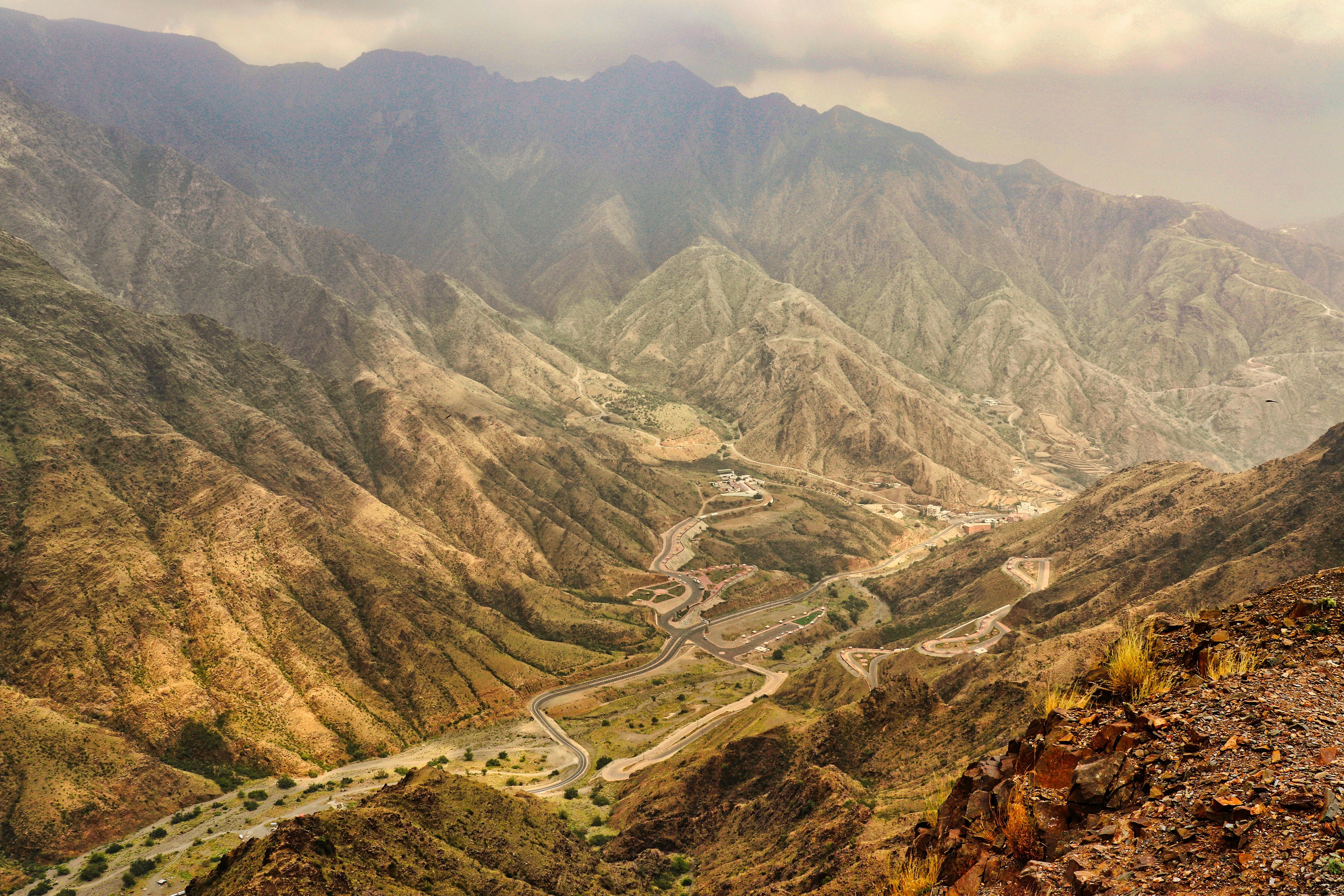 A road winding through a rugged mountain valley